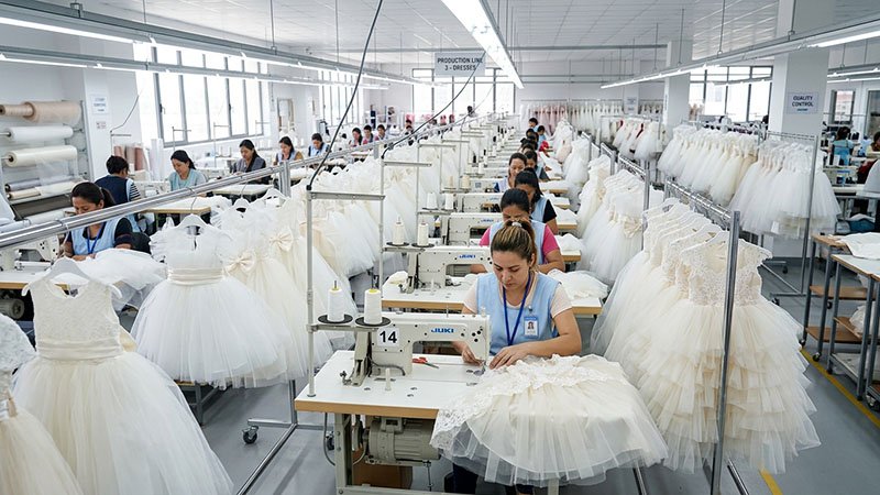 Flower girl dress factory production line in a childrenswear factory